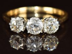 An 18ct gold ring set with three old cut diamonds, each approximately 0.2ct, in vintage box, 2.3g,