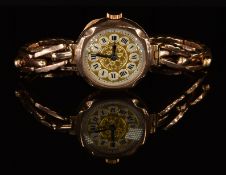 Unnamed 9ct gold ladies wristwatch with blued hands, black Roman numerals, silver and gold dial