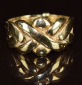 A yellow metal puzzle ring, 3.7g, size I