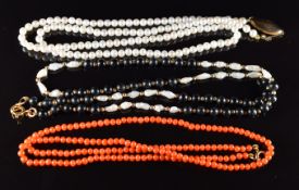 A coral necklace with 9ct gold clasp, onyx and pearl necklace with 9ct gold clasp and a strand of