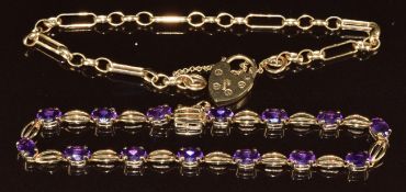A 9ct gold bracelet set with oval cut amethysts and a 9ct gold bracelet with heart padlock clasp,