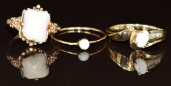 Three 9ct gold rings each set with an opal, 6g, size O, G & M