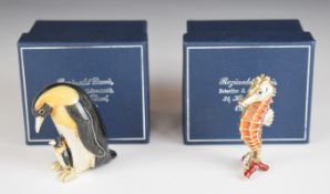 Pair of white metal and enamel novelty animals comprising penguin with chick and a seahorse, both