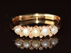 Victorian yellow metal ring ring set with five split pearls and rose cut diamonds (two missing), 3.