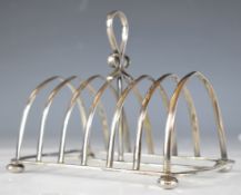 Victorian hallmarked silver seven bar toast rack raised on four bun feet, Chester 1898, maker John