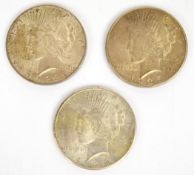 Three USA Liberty dollars comprising 1922, 1926 and 1935 Peace / eagle reverse