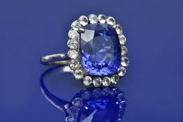 A 14k white gold ring set with a natural cushion cut purple-blue colour change Ceylon sapphire of