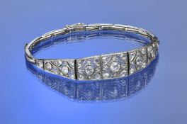 Art Deco 18ct white gold and platinum bracelet set with transitional cut diamonds in nine pierced