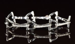 An 18ct white gold bracelet set with diamonds in a stirrup design, 24.3g, 17.5cm