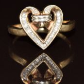 A 9ct gold ring set with diamonds in a heart shaped setting, 3.1g, size O