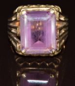 A 9ct gold ring set with an emerald cut amethyst, 8.6g, size O