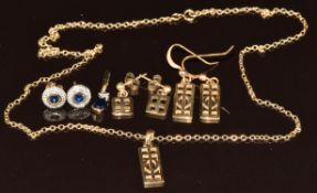 A 9ct gold pendant set with a sapphire and diamond, a pair of 9ct gold earrings each set with a