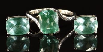 A 14k white gold ring set with a mixed emerald cut tourmaline and a pair of similar earrings, 4.