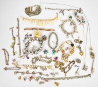 A collection of jewellery including nine silver charms, white metal charm bracelet, single ruby