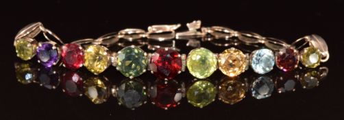 A yellow metal bracelet set with garnets, amethyst, zircons and tourmaline, tests as 8ct gold, 9.3g,
