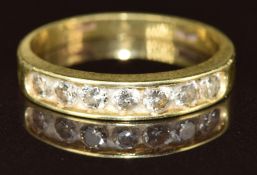 An 18ct gold ring set with seven diamonds, each approximately 0.09ct, 3g, size M