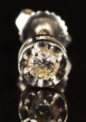 A 14k earring set with a diamond of approximately 0.13ct, 0.9g