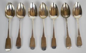 Seven Georgian and later hallmarked silver fiddle pattern table spoons, including Glasgow and Exeter