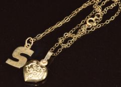 Two 9ct gold chains and pendants, 1.4g