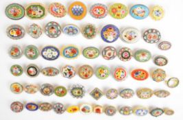 Fifty-eight micro mosaic brooches, mainly circular or oval depicting floral scenes