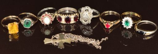 A 9ct gold ring set with an emerald cut synthetic yellow sapphire (2.7g, size P), three silver