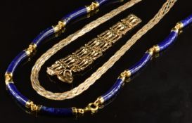A lapis lazuli necklace made up of elongated sections with 9ct gold clasp and fittings (20.8g), a