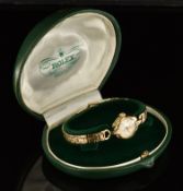 Rolex Precision 9ct gold ladies wristwatch with gold hands and hour markers, white dial and signed