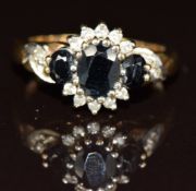 A 9ct gold ring set with sapphires and diamonds, 3.9g, size M
