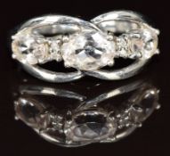 A 9ct gold ring set with three morganite and diamonds, 3g, size N