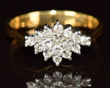 An 18ct gold ring set with a cluster of diamonds, 2.6g, size I