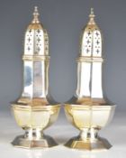 Pair of Victorian hallmarked silver sugar casters of octagonal baluster form, Sheffield 1899,