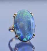A c1910 9ct gold ring set with a black opal measuring 16.4 x 24.4 x 4.1mm, 6g, size K