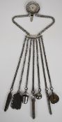 19thC seven chain cut steel chatelaine with attachments including penknife, tape measure, needle