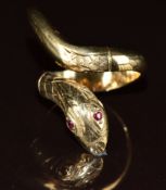 A 9ct gold serpent ring set with ruby eyes, 6.4g, size K
