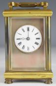 Late 19th or early 20th century carriage clock with bevelled glass panels, circular enamel dial