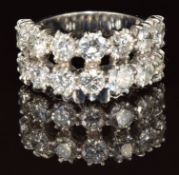 An 18k white gold ring set with fourteen round cut diamonds, each approximately 0.2ct, total diamond