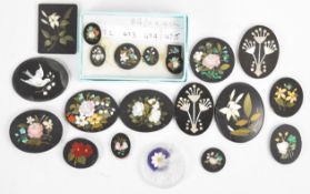 Twenty-one pietra dura plaques including one depicting a bird, the others floral
