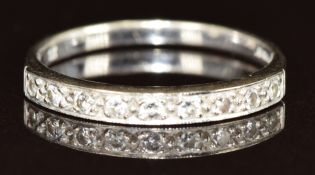 An 18ct gold ring set with nine diamonds, 2.1g, size M