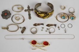 A collection of silver jewellery including six pairs of earrings, brooch, four rings, chain and