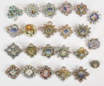 Twenty-three c1900 micro mosaic brooches including one in the form of a clover and one 'Roma'