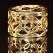 An 18k gold pendant set with amethysts, for an omega chain, 6.1g, 2 x 1.3cm