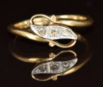 A 18ct gold ring set with three diamonds in a platinum setting, 3.3g, size O