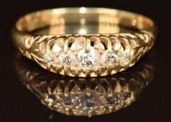 An 18ct gold ring set with five old cut diamonds, 3.5g, size S