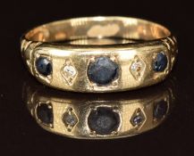 A 9ct gold ring set with three sapphires and two diamonds, 3g, size N