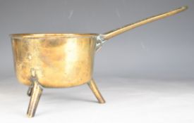 19thC bronze or similar saucepan with tripod base and 'Warner 4P' to handle, maximum height 21,