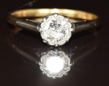 An 18ct gold ring set with a round cut diamond of approximately 0.5ct in a platinum setting, 1.8g,