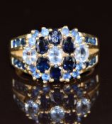 A 9ct gold ring set with sapphires and topaz in a cluster, 5.2g, size O