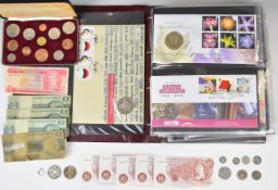 Album of coin covers including 50p, £1 and £2 examples, silver coinage, last sterling and first