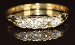 An 18ct gold ring set with five diamonds, 3.1g, size Q