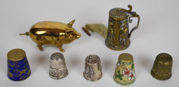 Brass novelty pig sewing tape measure and dual tape / thimble holder in the form of a flagon,